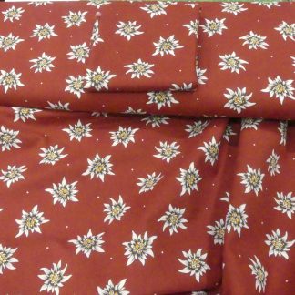 Tissu edelweiss fond bordeaux