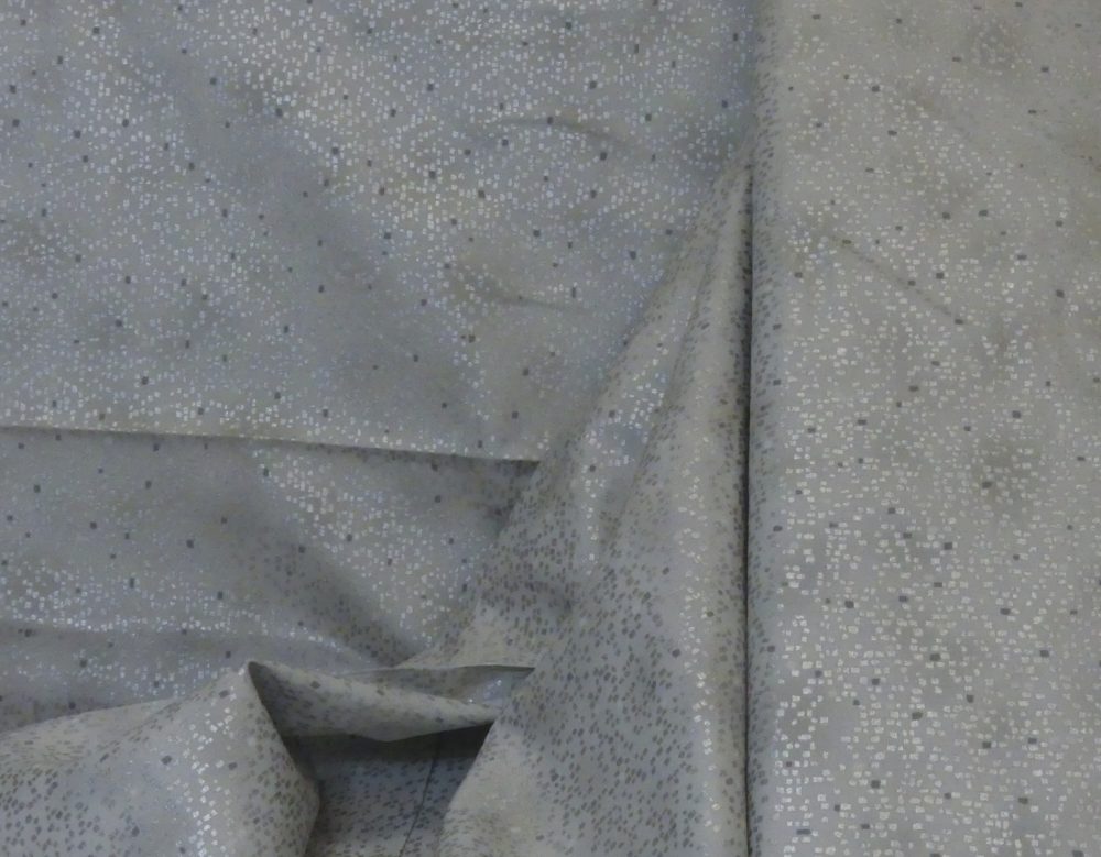 Tissu point argent fond gris