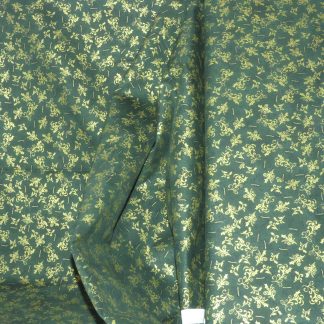 Tissu feuille or fond vert