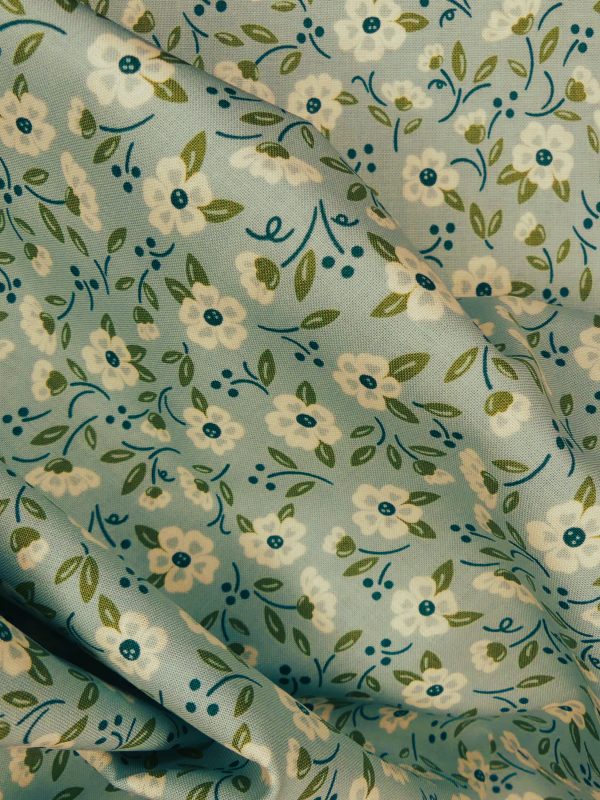 Tissu motif fleurs écru