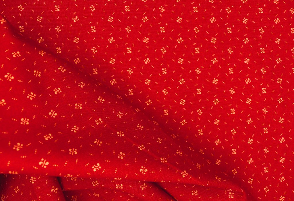 Tissu faux uni rouge
